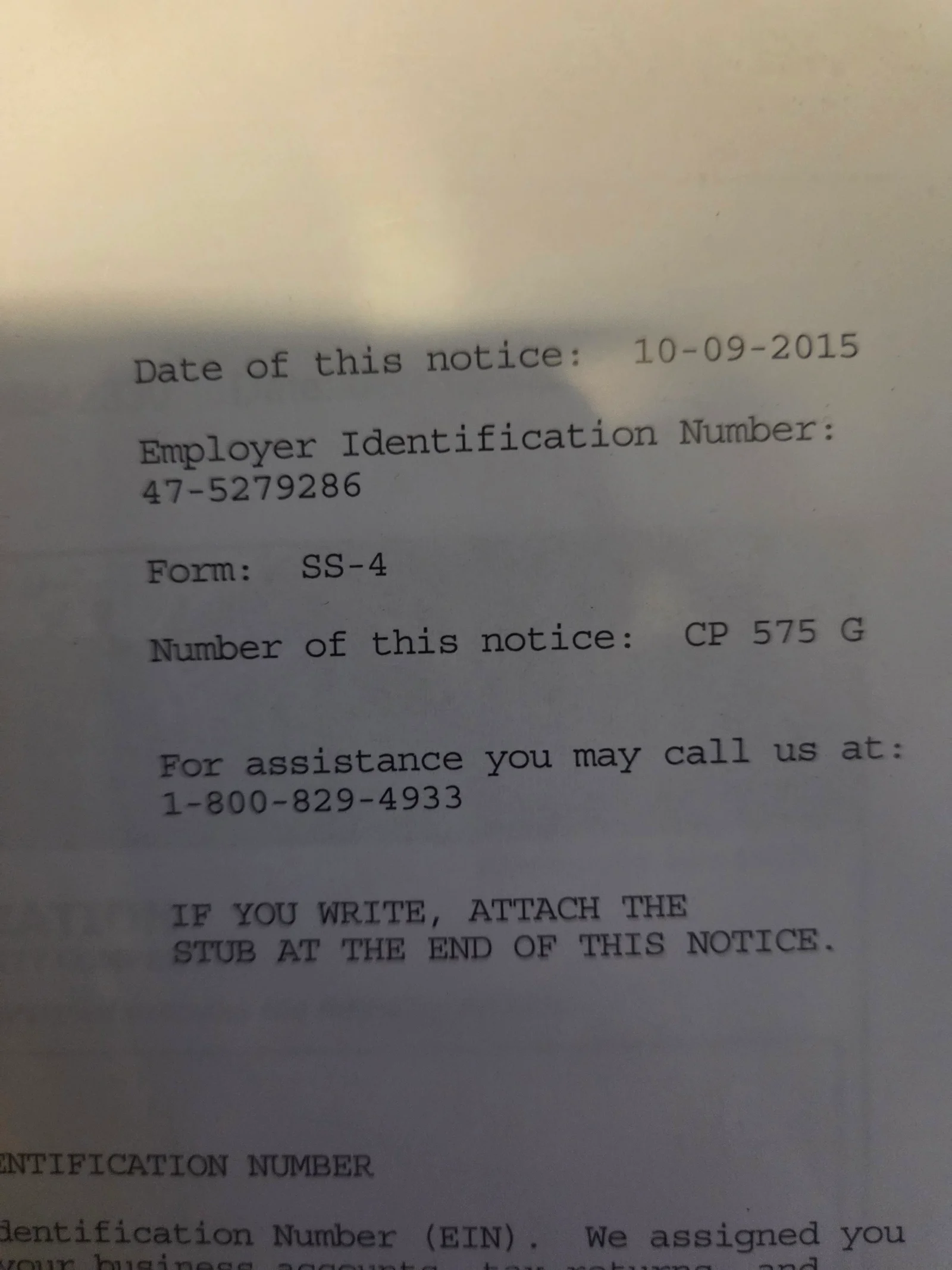 Printed IRS CP 575 G notice showing employer identification number assignment on white paper